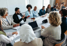 Professionals collaborating around a conference table.
