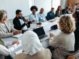 Professionals collaborating around a conference table.