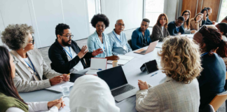 Professionals collaborating around a conference table.